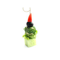 3418. Herb coated cheese ball on a cucumber