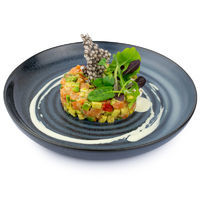 Salmon tartar with avocado, tomatoes, fresh ginger with wasabi sauce